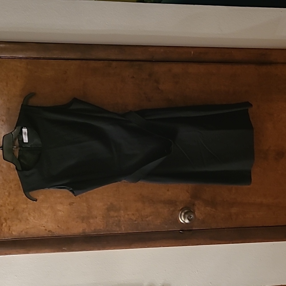 Black shift dress with a matte black metal belt.